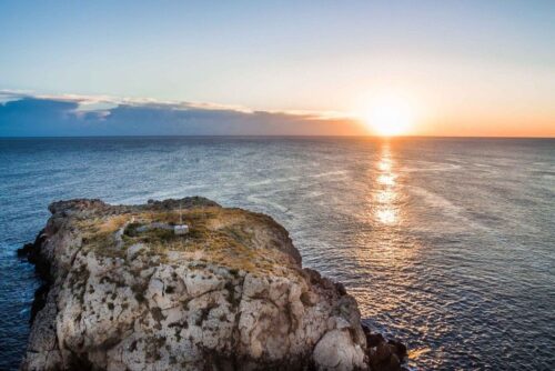 Sunset on a rowboat in Polignano a Mare